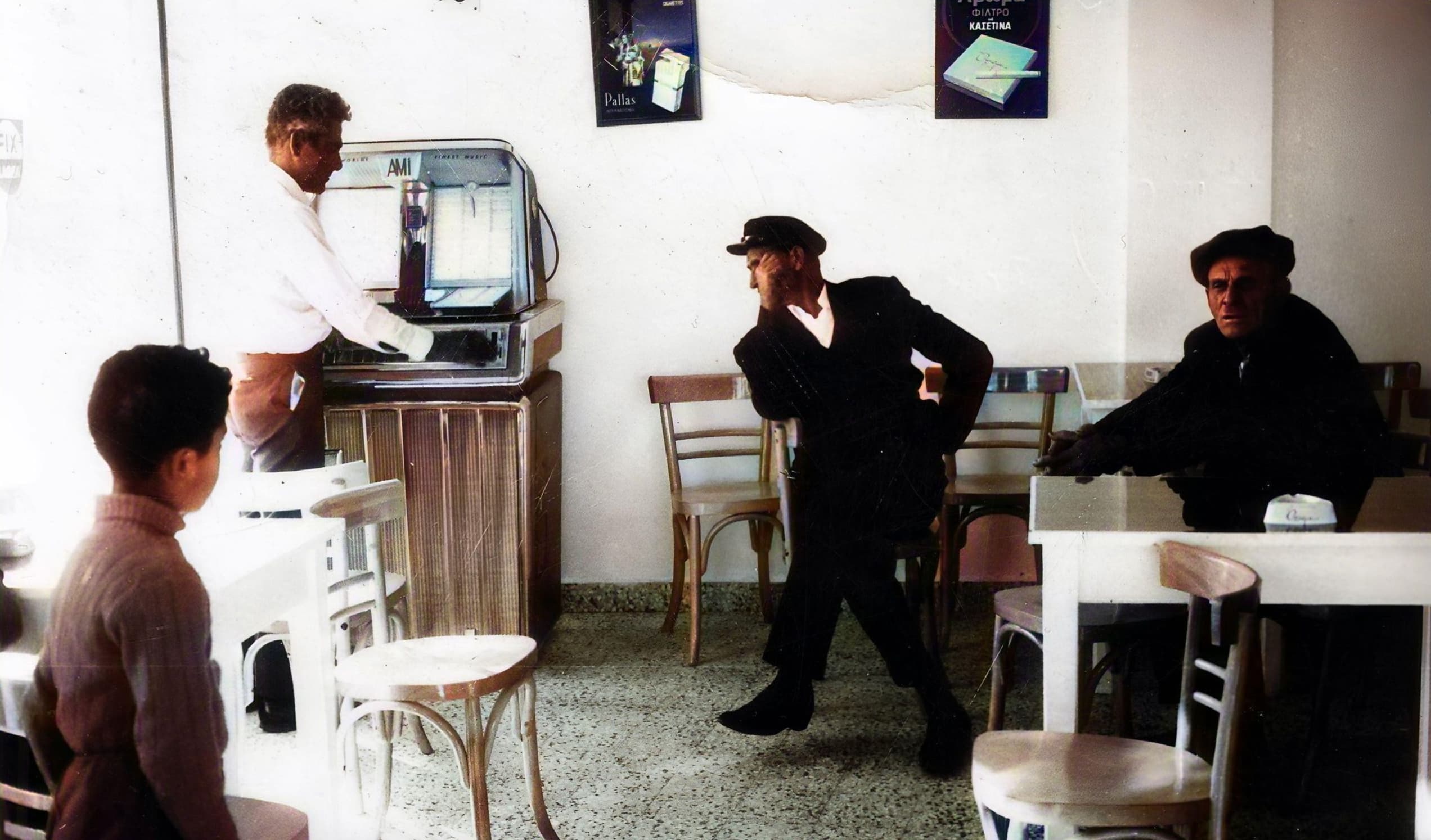 “My uncle (middle) with some friends in a cafe in Greece 1970s.”